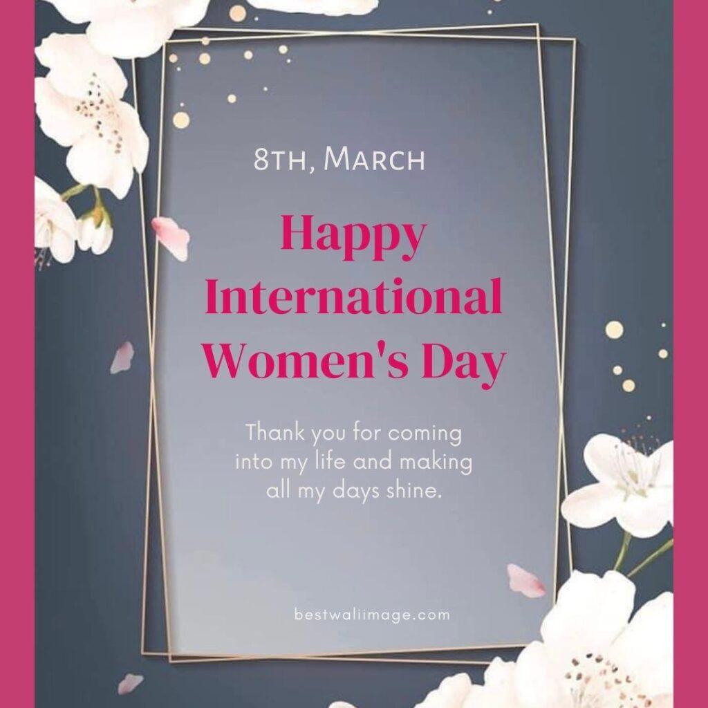 Happy International Women's Day written on pink and gray frame